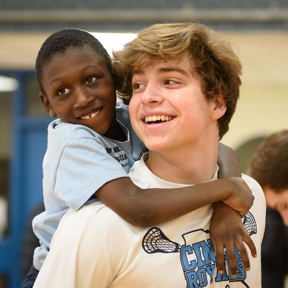 Kid getting a piggy back ride